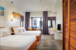 A hotel room with two beds, a desk, a chair, a TV, and a balcony with curtains. - Silver Smith Residence (Siem Reap)