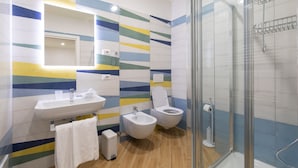A bathroom with a sink, bidet, toilet, and glass shower enclosure. - VIAPARSANO - two bedrooms flat (Sorrento)