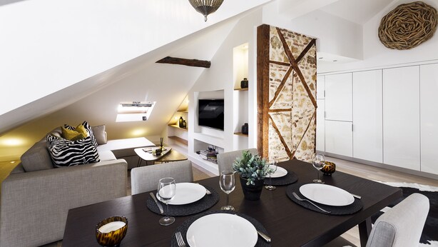 A modern loft apartment with a dining area, living space, and kitchen. - Madalena Downtown Luxury Duplex (Lisbon)