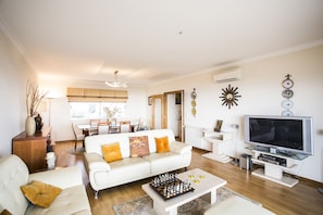 Apartment, 2 Bedrooms, 2 Bathrooms, Sea View | Living area | Flat-screen TV