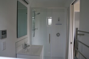 Shower, hair dryer, towels, soap
