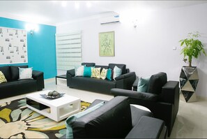 Apartment, 4 Bedrooms | Living area | 32-inch flat-screen TV with cable channels, TV - Droptop Suites (Lekki)