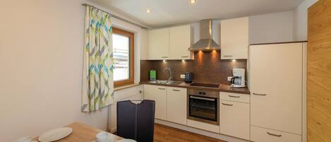 Fridge, stovetop, dishwasher, coffee/tea maker