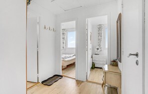 Enjoy a simple, functional space with a bed, dresser, and mirror.