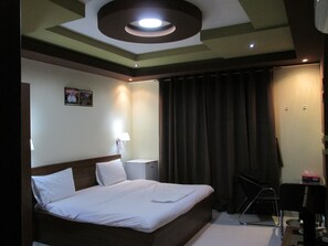 Blackout drapes, soundproofing, iron/ironing board, rollaway beds