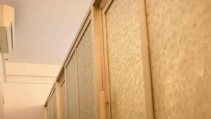 A hallway with wooden flooring and frosted glass doors. - Adler Lady Guesthouse - Women Only (Yangon)