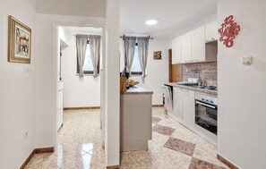 Fridge, stovetop, dishwasher, coffee/tea maker
