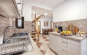 Fridge, stovetop, dishwasher, coffee/tea maker