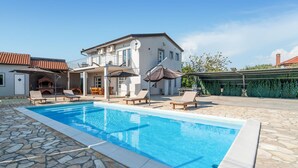 A modern house with a swimming pool, outdoor furniture, and a barbecue area. - Awesome home in Islam Latinski (Islam Latinski)