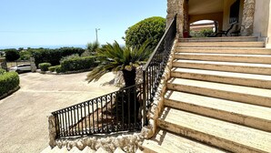 A stone staircase leading to a covered porch with a view of the sea. - Villa Rina - relaxing vacations in the hills with beautiful pool exclusively (Avola)