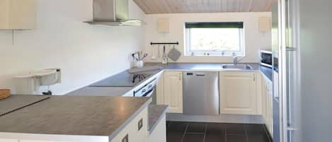 Fridge, stovetop, dishwasher, coffee/tea maker