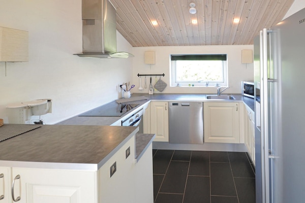 Fridge, stovetop, dishwasher, coffee/tea maker