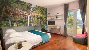 A bedroom with a bed, a desk, a chair, a small table, and a large window with curtains. - Stunning home in Split (Split)