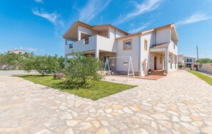 Experience the perfect blend of modern and traditional styles in this two-story building with a covered outdoor area and balcony.