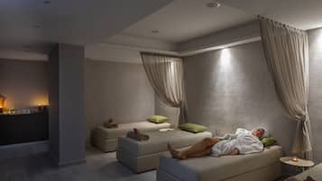 Relax in a serene space with a comfortable sofa, side tables, and soft ambiance.