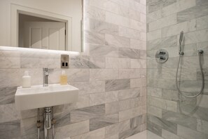 Shower, hair dryer, towels, soap