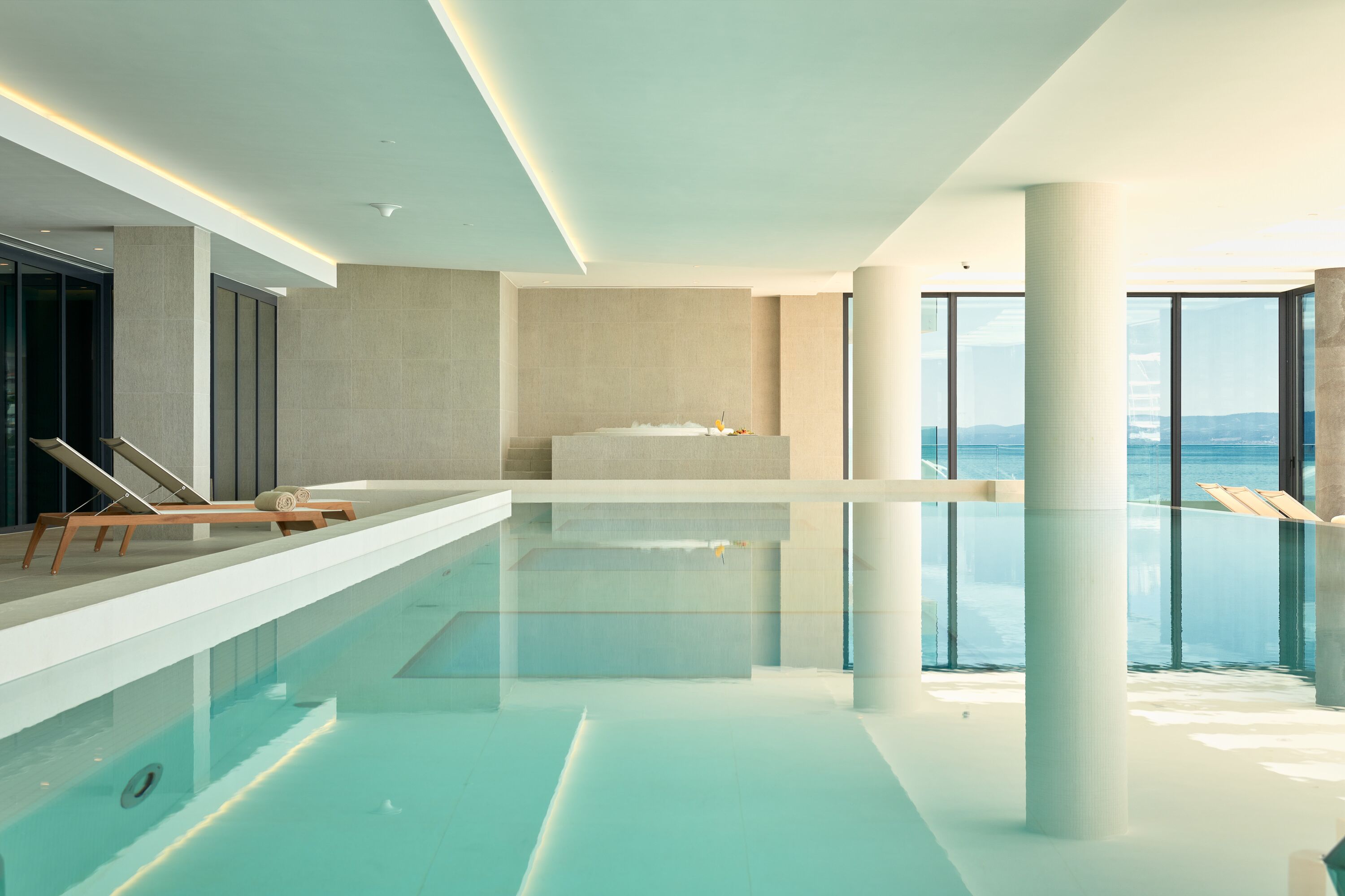 Indoor pool, seasonal outdoor pool, pool umbrellas, pool loungers