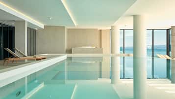 Indoor pool, seasonal outdoor pool, pool umbrellas, pool loungers