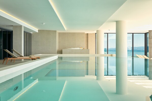 Indoor pool, seasonal outdoor pool, pool umbrellas, sun loungers
