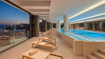 Indoor pool, outdoor pool, pool umbrellas, sun loungers