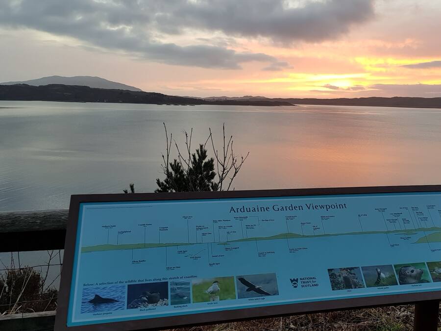 A signboard titled 'Arduaine Garden Viewpoint' with a map and wildlife illustrations.