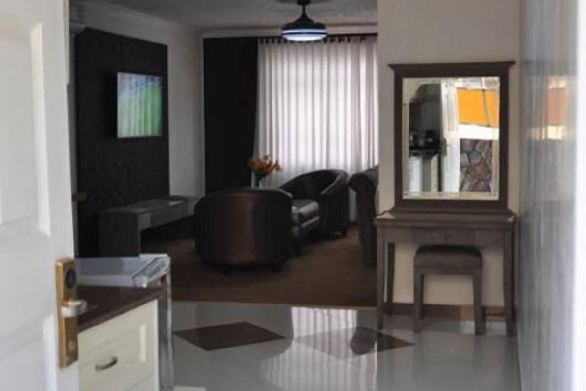 Family Studio | Living area | 50-inch flat-screen TV with satellite channels, TV