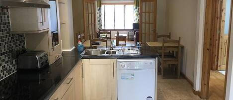 Apartment | Private kitchen | Full-size fridge, microwave, oven, stovetop