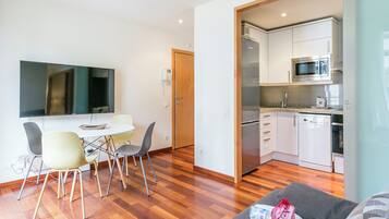 Basic Apartment, 1 Bedroom | Living area | Flat-screen TV