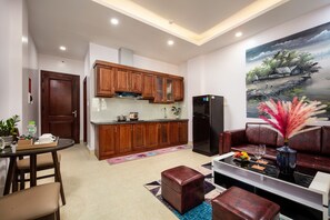 Appartement Prestige, 1 chambre | Aire de séjour | Téléviseur à écran plat de 40 po avec télévision numérique, téléviseur