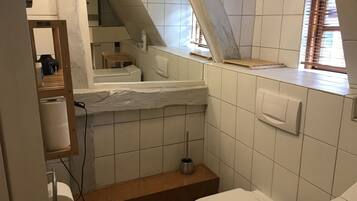 Shower, hair dryer, towels, toilet paper