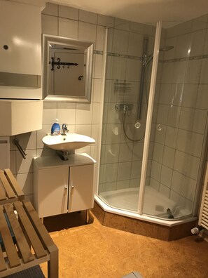 Shower, hair dryer, towels, toilet paper