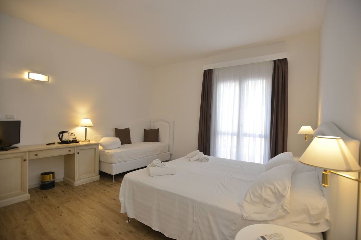 Comfort Triple Room, Private Bathroom (external) | Minibar, in-room safe, desk, blackout curtains