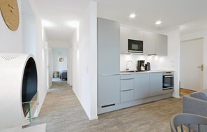 Fridge, stovetop, dishwasher, coffee/tea maker
