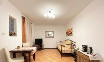 Apartment, 1 Schlafzimmer | Wohnbereich | Flachbildfernseher