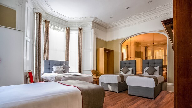 Standard Triple Room, Multiple Beds (Shared) | Desk, iron/ironing board (on request), individually decorated - Clifton Mount Hotel (Newcastle-upon-Tyne)