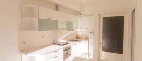 Fridge, oven, dining tables