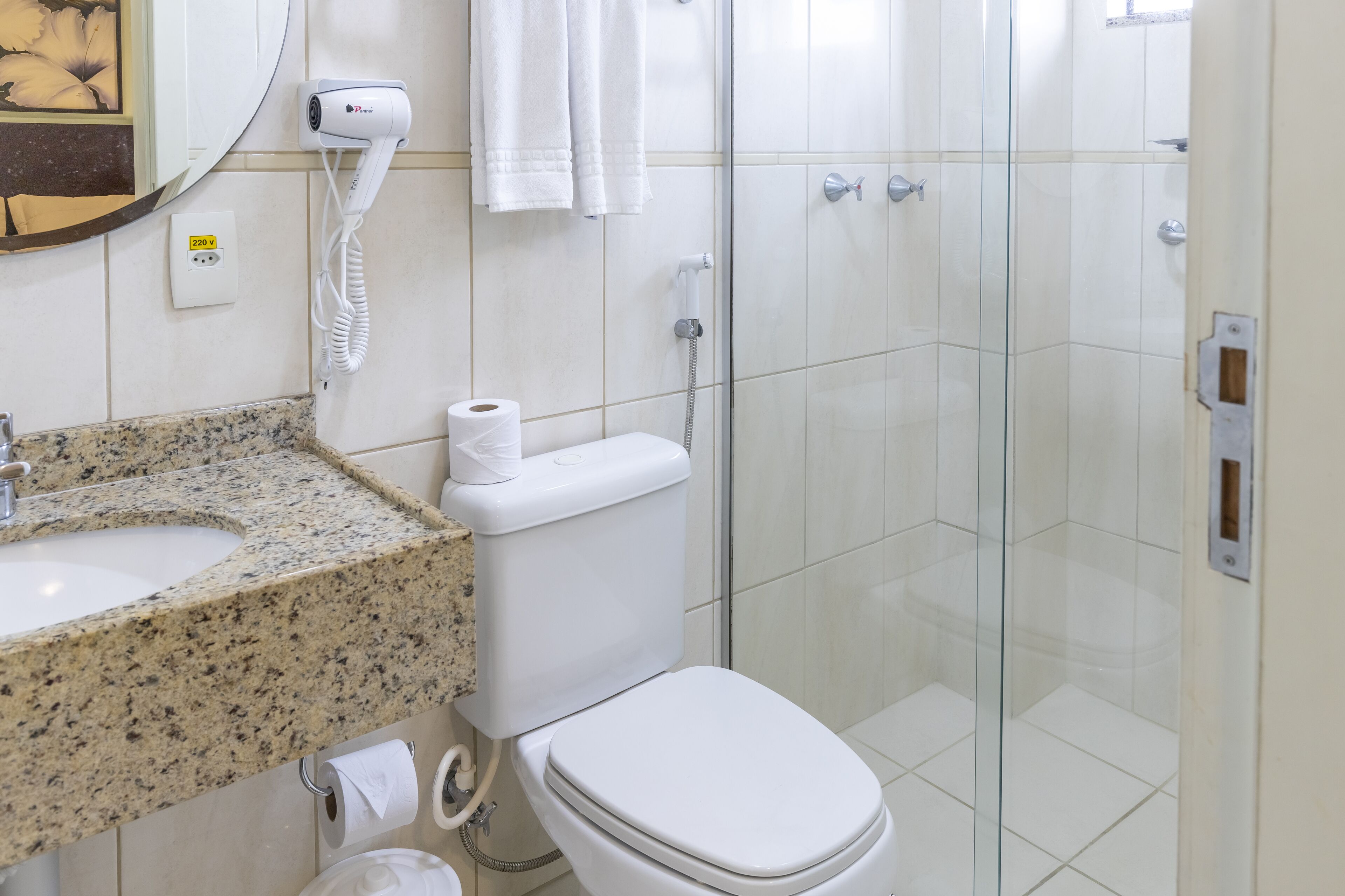 shower, designer toiletries, hair dryer, towels