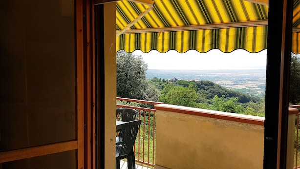 A balcony with a view of a green landscape and distant cityscape. - Apartment/ flat - Gavorrano (Gavorrano)
