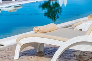 Outdoor pool, pool umbrellas, pool loungers
