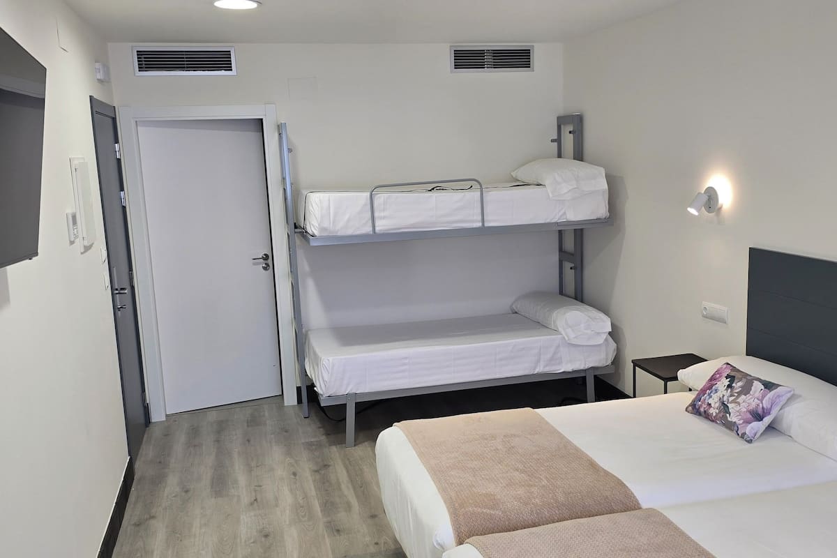 Family Quadruple Room | Premium bedding, down comforters, memory foam beds, blackout drapes