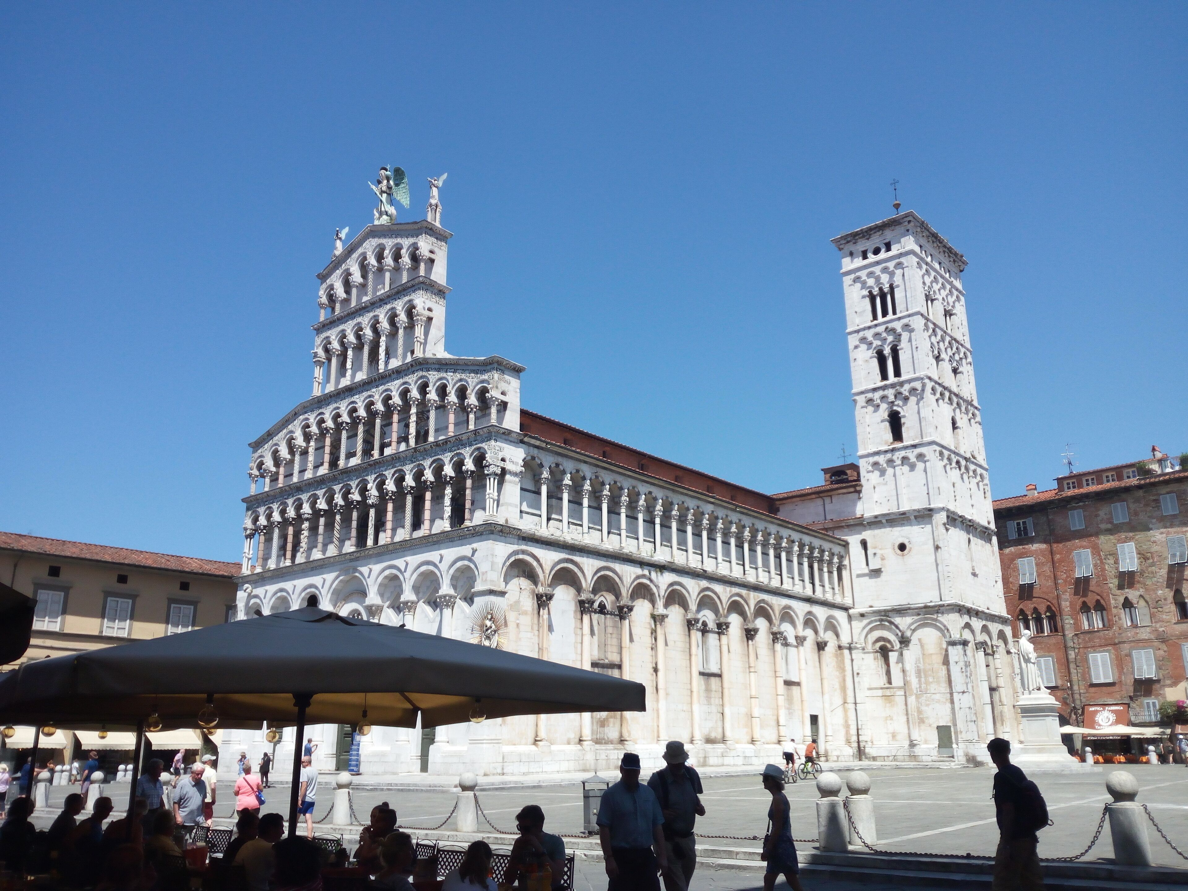 A historic building with a prominent bell tower and intricate architectural details.