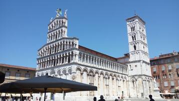 A historic building with a prominent bell tower and intricate architectural details.