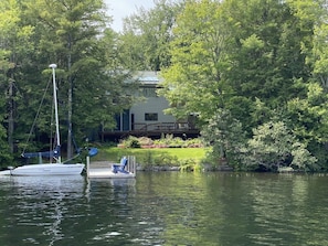 A house with a dock and a boat.