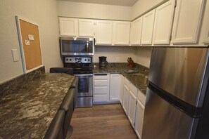 House (SH10) | Private kitchen | Fridge, microwave, oven, stovetop - Sherpa Studio (Whitefish)