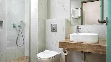 Shower, hair dryer, towels, shampoo