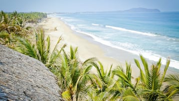 On the beach, sun loungers, beach towels