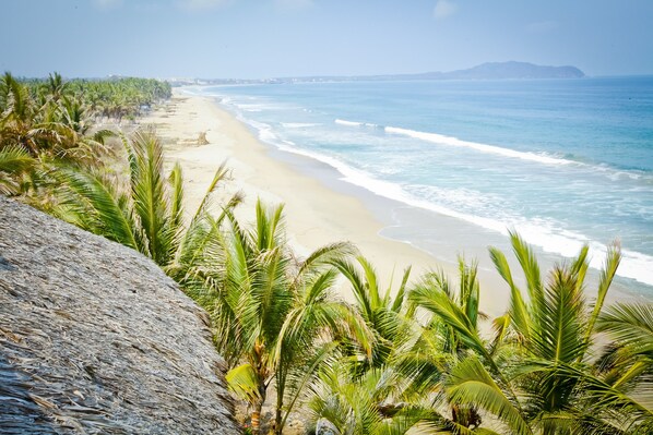 On the beach, sun-loungers, beach towels