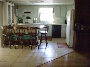 Fridge, microwave, oven, stovetop - Three Bedroom House on Private Lake Delancy in Ocala National Forest (Salt Springs)