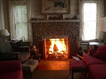 Living room and fireplace on a cool fall day.