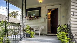 A porch with steps, a chair, and potted plants. - Walla Walla Gem - Peaceful, Private and a Perfect Central Location  (Walla Walla)